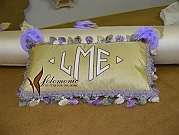 Pillow with matching trim and appliqué monogram